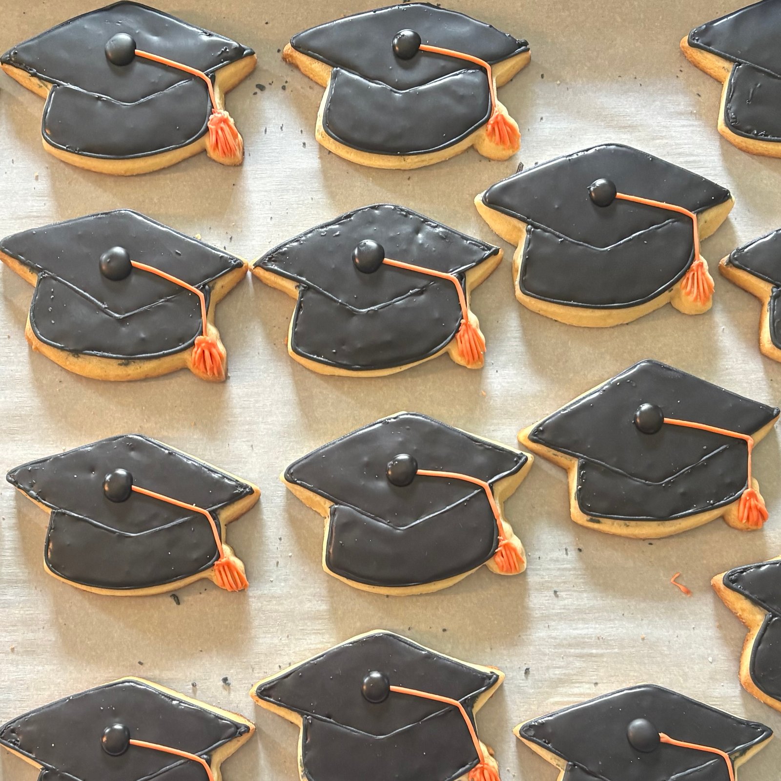 cookies decorated as graduation caps